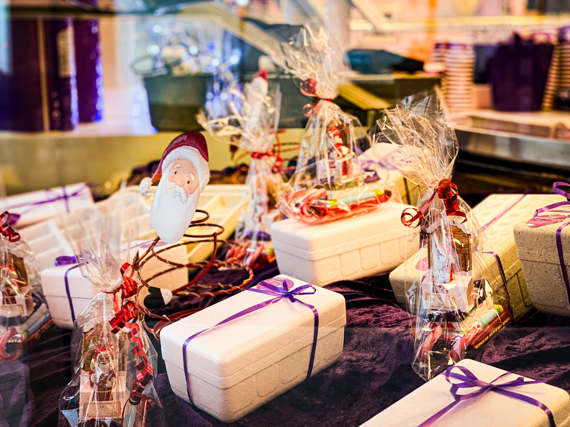 Festive gift boxes and sweet cones on the parlour counter