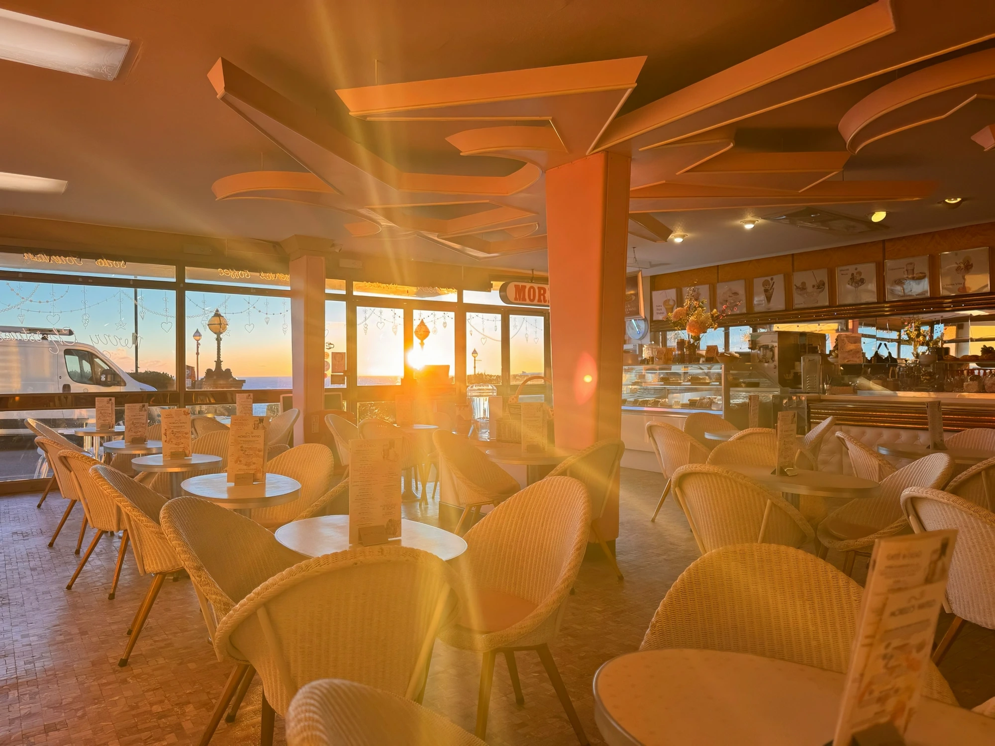 Golden evening light flooding the Morelli's parlour